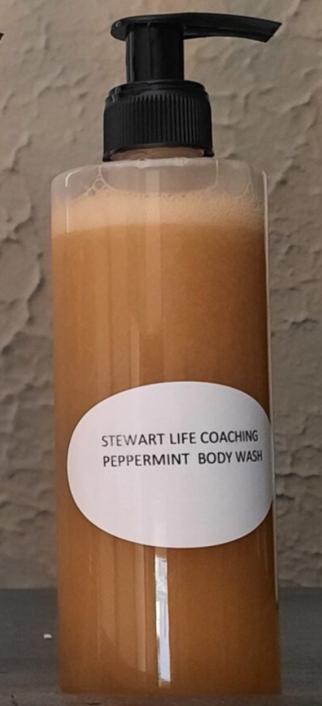 A bottle of body wash with the label " stewart life coaching peppermint body wash ".