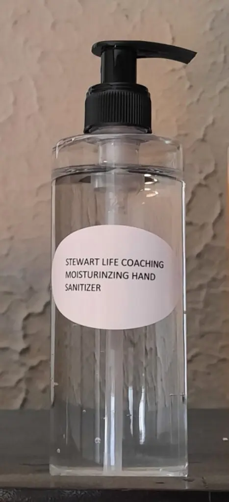 A bottle of hand sanitizer with the label " stewart life coaching moisturizing hand sanitizer ".
